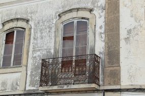 balcony on the facade of an old house in the city of Faro