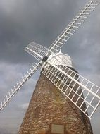 windmill on a background of dark clouds
