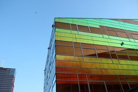 glass building reflecting lights architecture
