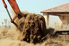 Bulldozer bucket with soil