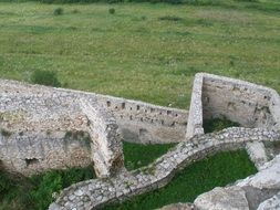 Fortress ruins on meadow, top view, Slovakia