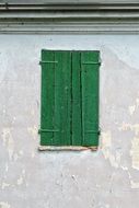 green wooden window shutters