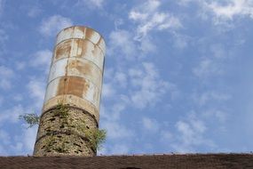 industrial Chimney above Roof at Sky