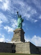 statue of liberty under the clouds