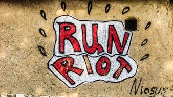 graffiti run riot on a wall in Greece