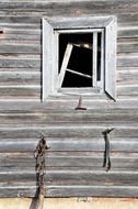 broken window in a wooden barn