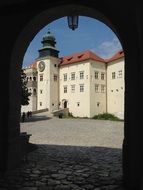 view of the castle through the arch in poland