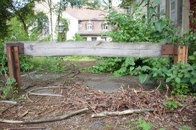 wooden barrier on the road to the houses