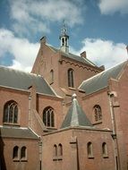 brick church on a background of clouds