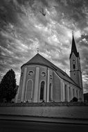 black and white photo of the church with a spire