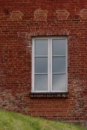 White window of the brick castle