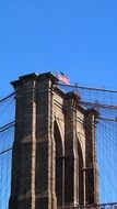 america flag on brooklyn bridge
