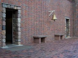 bell on brick wall in germany