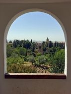 city view through an arched window