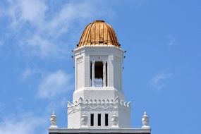 bell tower in the church against the sky with clouds