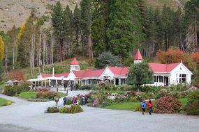 people in Beautiful park with flowers and pavilion at autumn landscape, new zealand, queenstown