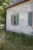 old house near green trees