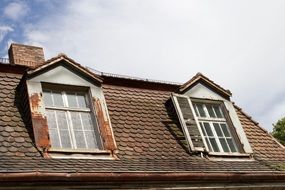 windows on tile Roof of old house