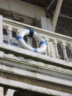 Buoy on Balcony of Old House