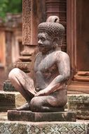 stone sculpture in front of a buddhist temple
