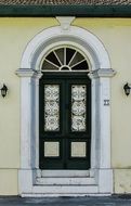 Old Wooden Entrance Door in arch, cyprus, larnaca