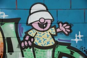 Street Art Graffiti man in hat drawing