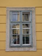 window frame in a yellow house