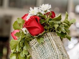 a bouquet of flowers in a fabric wrapper