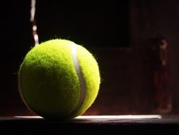 yellow tennis ball on the table