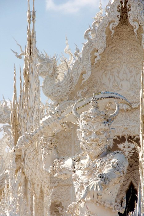 Beautiful White Temple with sculptures in Thailand - the most unusual temple