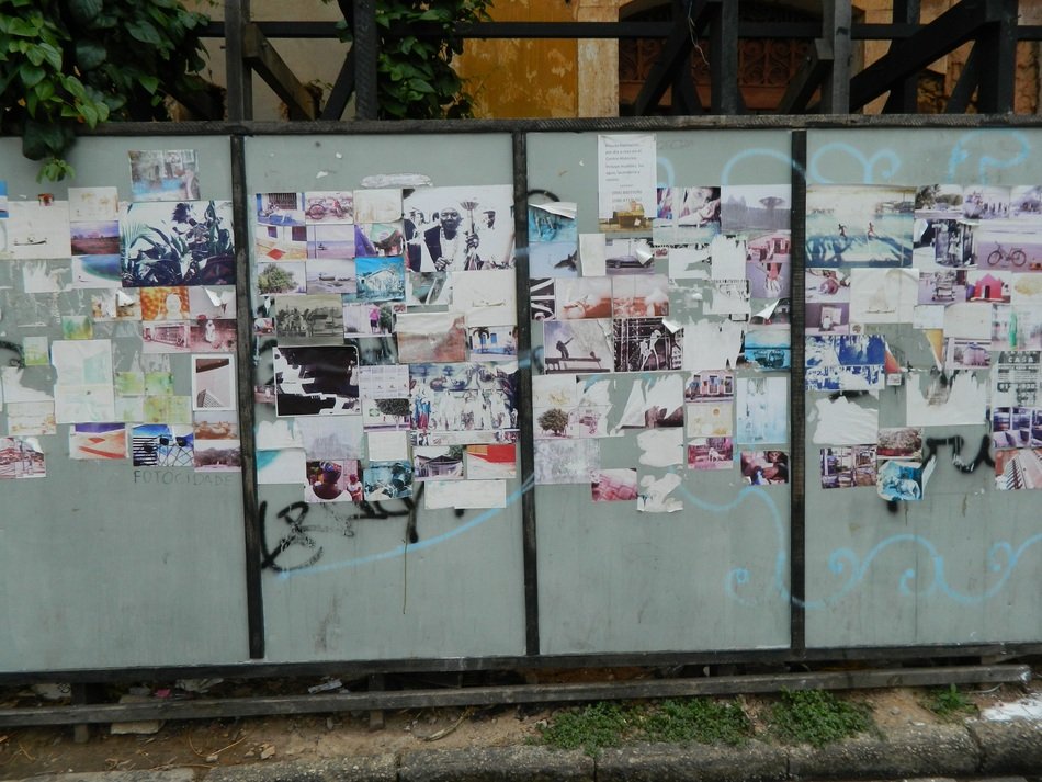 Wall with posters on it