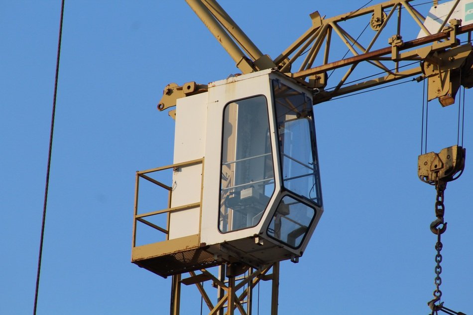 white cab of construction machinery at blue sky background