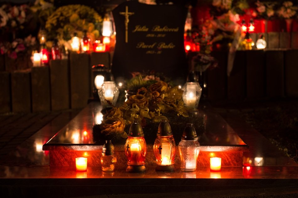 burning candles on the grave