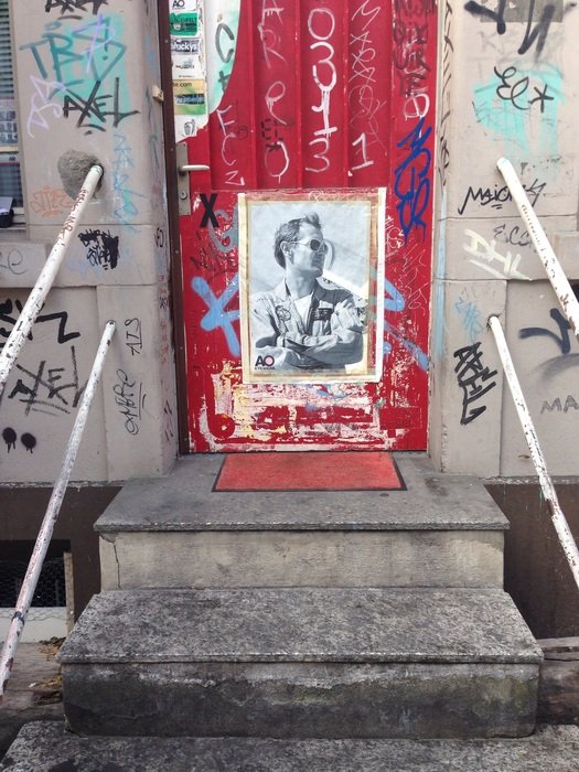 steps in front of a bright door with graffiti, switzerland, zurich