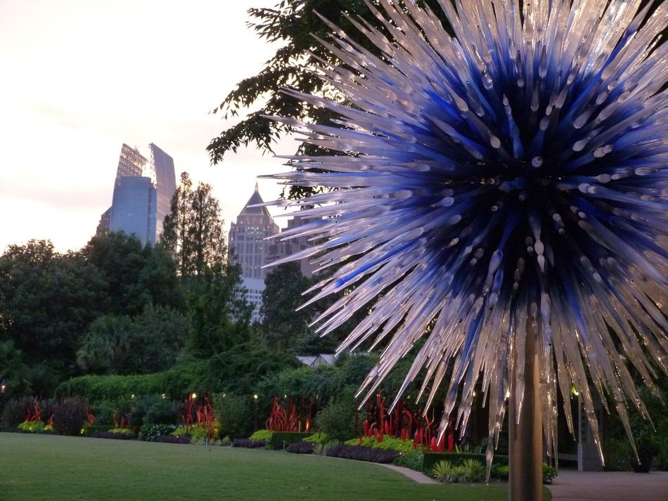 glass flower on a background of city panorama