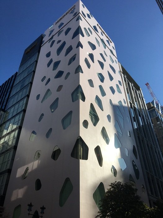 unusual windows on the facade of the building