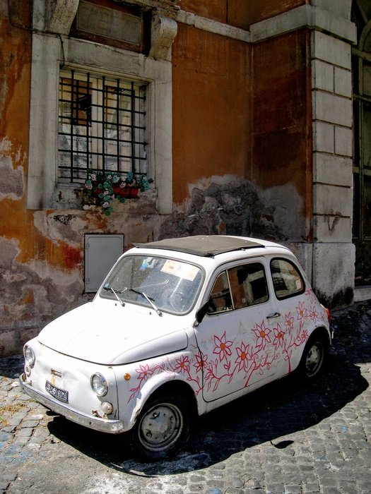 small white car with flowers
