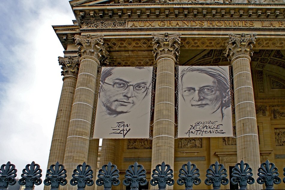 a building with columns and a picture of people in Paris
