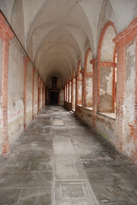 red brick corridor with large windows