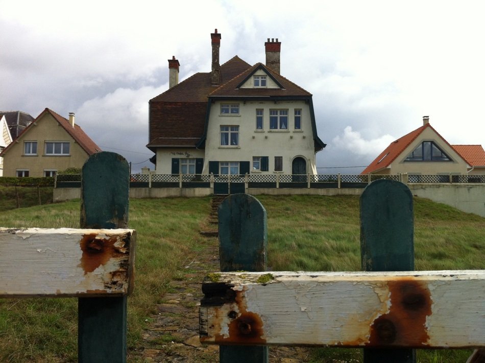 white house on the coast in belgium