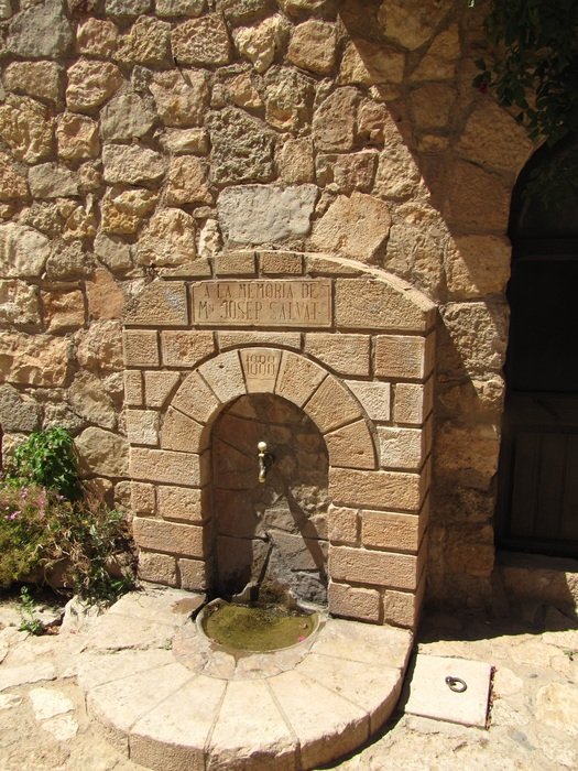 stone source on a wall facade in europe