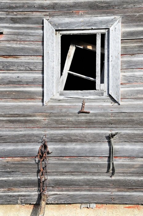 broken window in a wooden barn