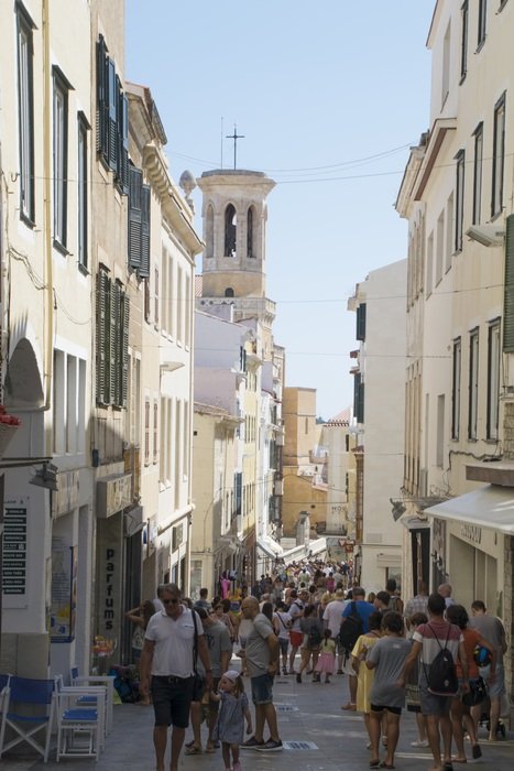 A lot of people on the street in in Minorca, Spain