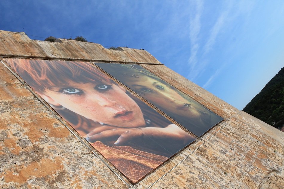 Laetitia Casta on the stone wall