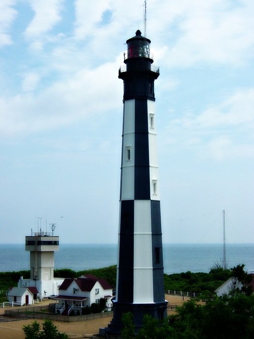 lighthouse on the shore near the ocean
