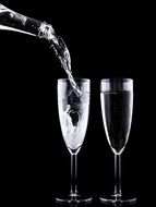 champagne glasses with sparkling beverage