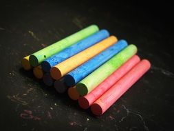 multicolored chalk stacked on top of each other