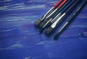 art supplies on blue sheet