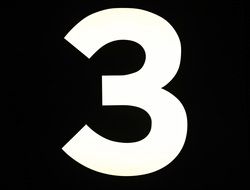 number three on the black background