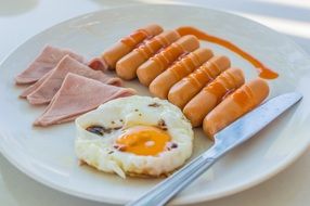 knife on a plate with breakfast